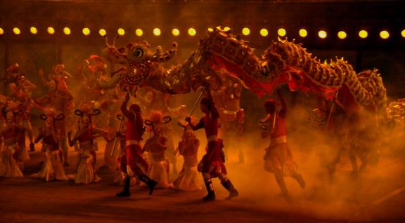 Masked dancers with dragon dance