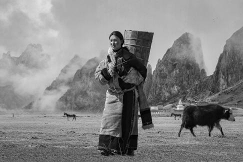 Tibetan women carrying buckets