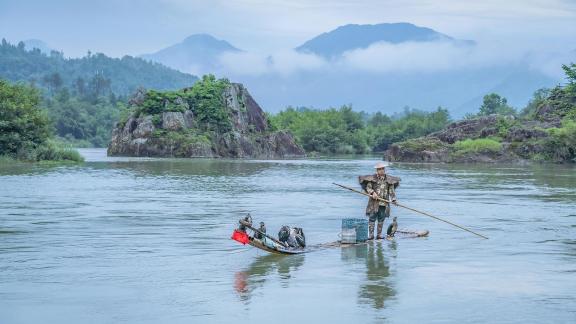 Fisherman on a Bamboo Baft