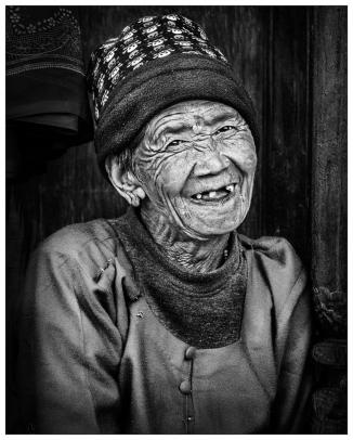 An old woman smiles