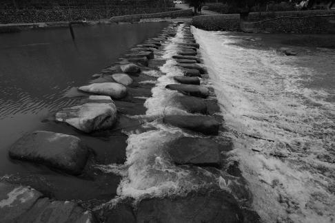White waves chasing stones 1