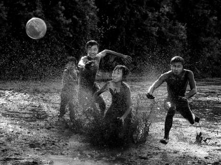 Playing ball in mud