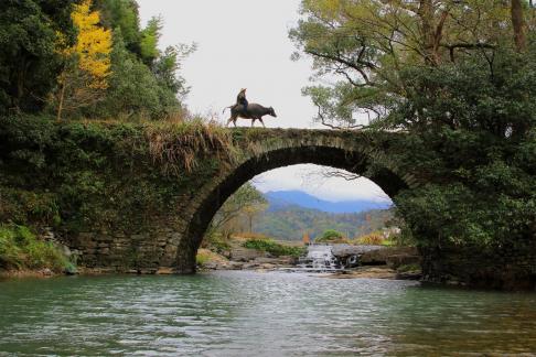 Old Man Crossing the Ancient Bridge